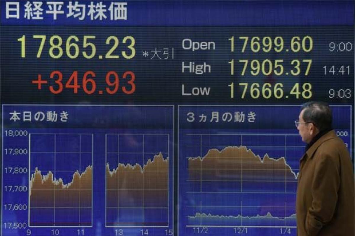 Asian shares slip as crude resumes drop